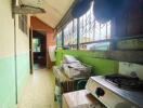 Narrow kitchen with stove and storage