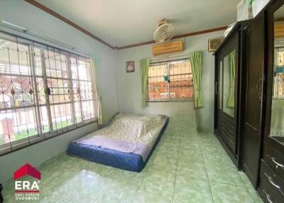 Bedroom with air conditioning and floor mattress
