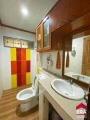 Bathroom with modern fixtures and vibrant colored tiles