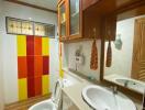 Bathroom with modern fixtures and vibrant colored tiles