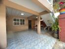 Outdoor patio area near stairs with table and chairs