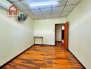 Empty room with wooden floor and ceiling fan