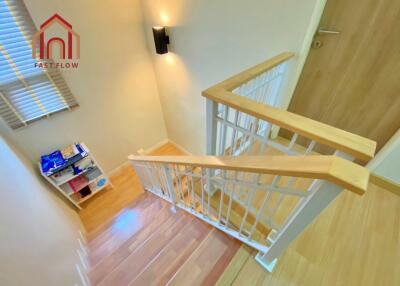 Interior staircase with wooden railings