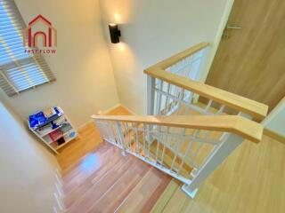 Interior staircase with wooden railings