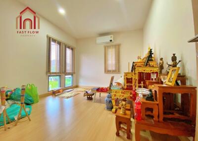 Bright living room with wooden flooring and traditional decorations