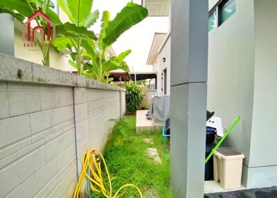 Outdoor area with greenery and building exterior