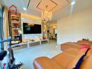 Modern living room with chandelier and large TV