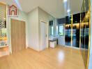 Modern bedroom with vanity area and wooden flooring