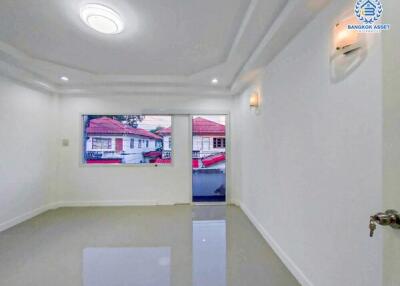 Modern living room with polished floor and large window