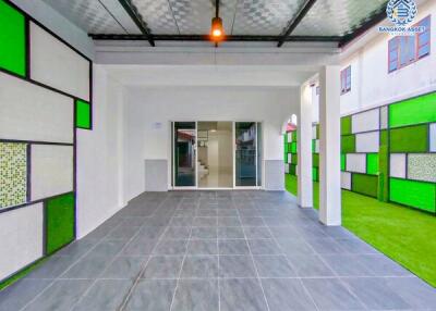 Modern garage area with tiled floor and colorful glass panels