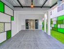 Modern garage area with tiled floor and colorful glass panels