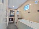 Modern bathroom with large bathtub and glass partitions