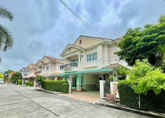 Exterior view of townhouse buildings on a residential street