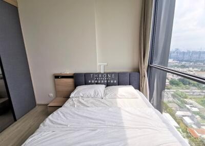 Bedroom with bed and large window view