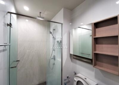 Modern bathroom with glass-enclosed shower