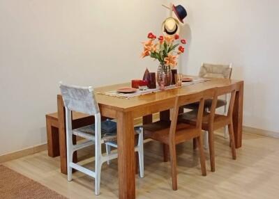 Dining area with wooden table and chairs