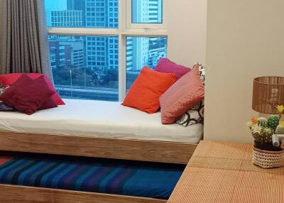 cozy bedroom with a trundle bed and city view