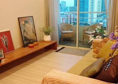 Cozy living room with balcony access and decorative elements