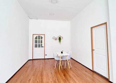 Minimalist dining area with a small table and chairs