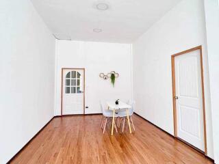 Minimalist dining area with a small table and chairs