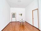 Minimalist dining area with a small table and chairs