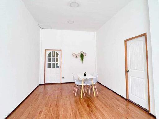 Minimalist dining area with a small table and chairs