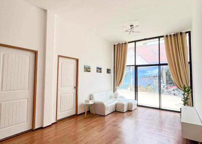 Spacious living room with large windows