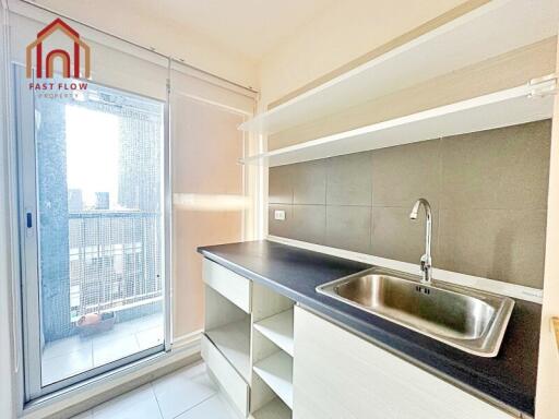 Modern kitchen with sliding door and open shelves