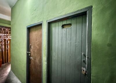 Entrance with two doors in an interior hallway