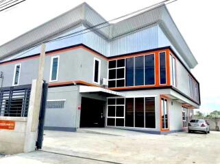 modern two-story residential building with large windows