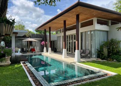 Modern house with pool and outdoor seating area