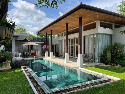 Modern house with pool and outdoor seating area