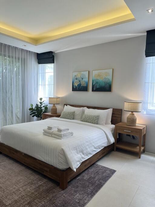 Modern bedroom with cozy decor and natural light