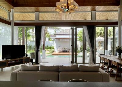 spacious living room with large windows and outdoor view
