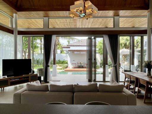 spacious living room with large windows and outdoor view