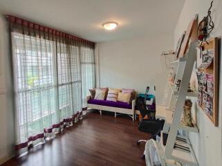 Living room with large windows and modern decor