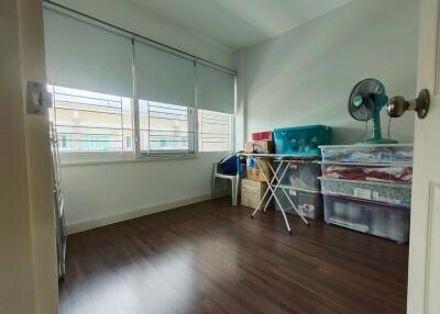 Spare room with storage boxes and fan