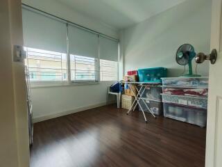 Spare room with storage boxes and fan