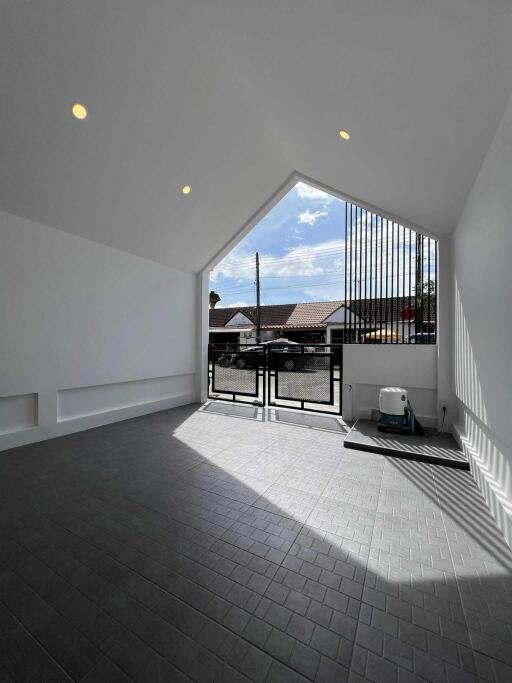 Bright room with large window and tiled floor