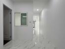 Bright and modern hallway with marble flooring