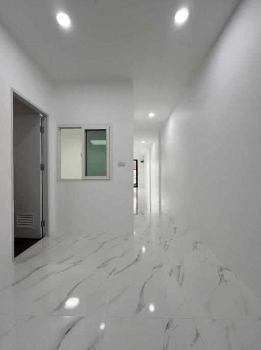 Bright and modern hallway with marble flooring