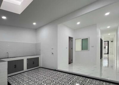 Modern kitchen with black and white patterned floor