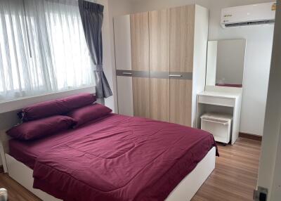 Bedroom with double bed, wardrobe, and air conditioning