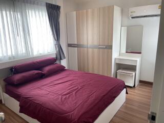 Bedroom with double bed, wardrobe, and air conditioning