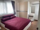 Bedroom with double bed, wardrobe, and air conditioning