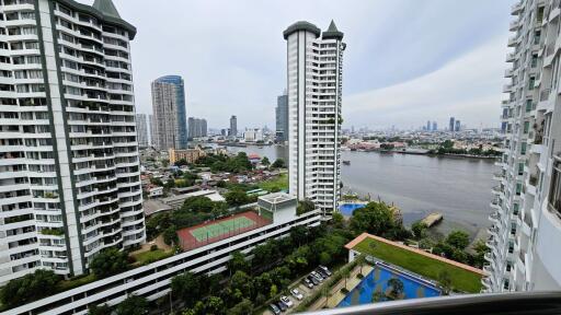 City skyline with river view from a high-rise balcony