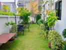 Well-maintained garden with dining area and greenery