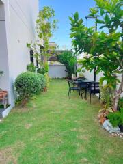 Well-maintained garden with outdoor seating area