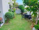 Well-maintained garden with outdoor seating area