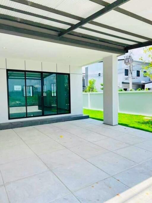 Covered outdoor patio with large windows